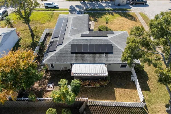 an aerial view of a house with swimming pool