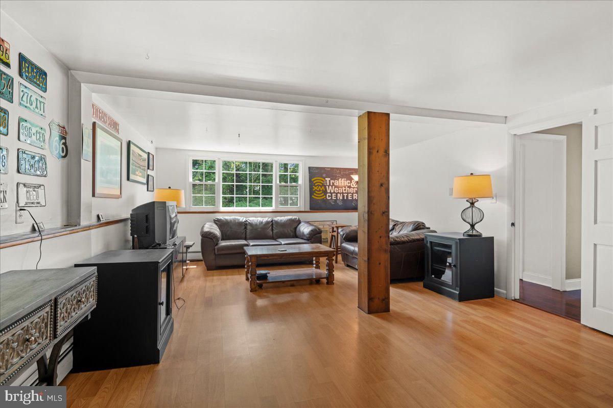 111 Howard Way Pennington, NJ 08534 - Photo 12 of 31 a living room with furniture and a window