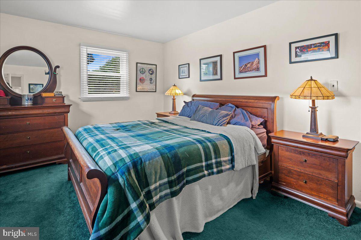 111 Howard Way Pennington, NJ 08534 - Photo 23 of 31 a bedroom with a bed and a dresser