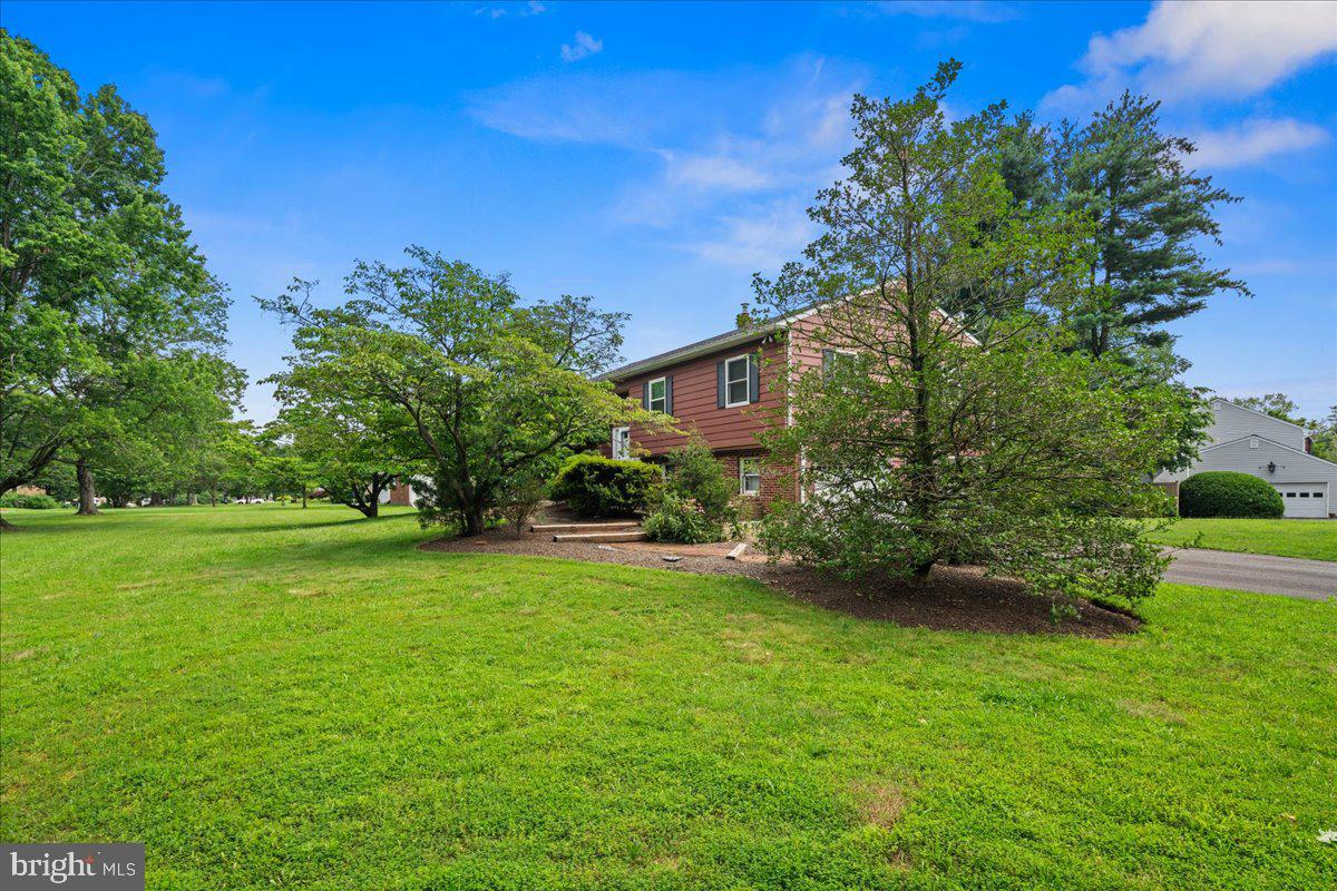 111 Howard Way Pennington, NJ 08534 - Photo 26 of 31 a front view of a house with a yard