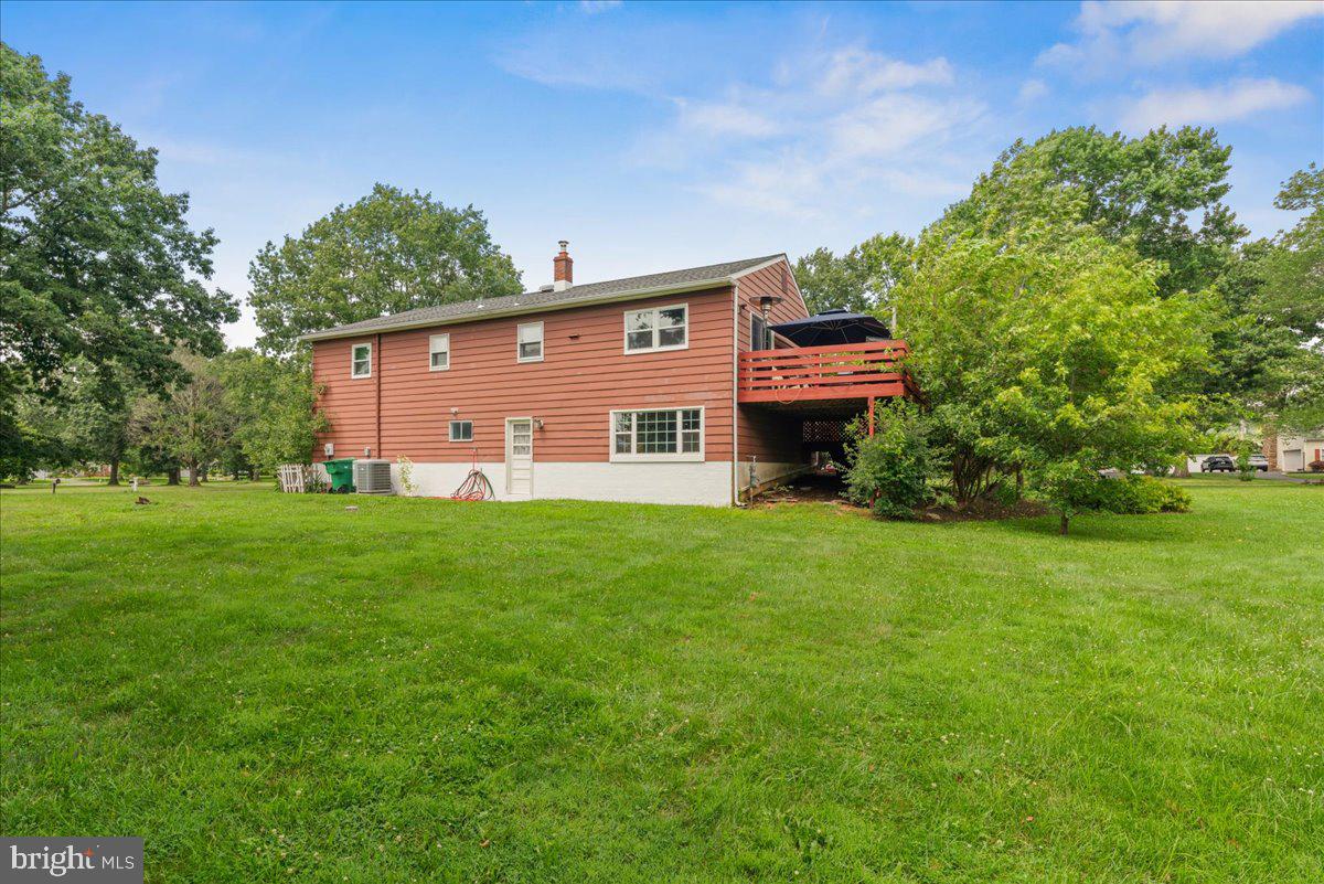 111 Howard Way Pennington, NJ 08534 - Photo 3 of 31 a backyard of a house with lots of green space