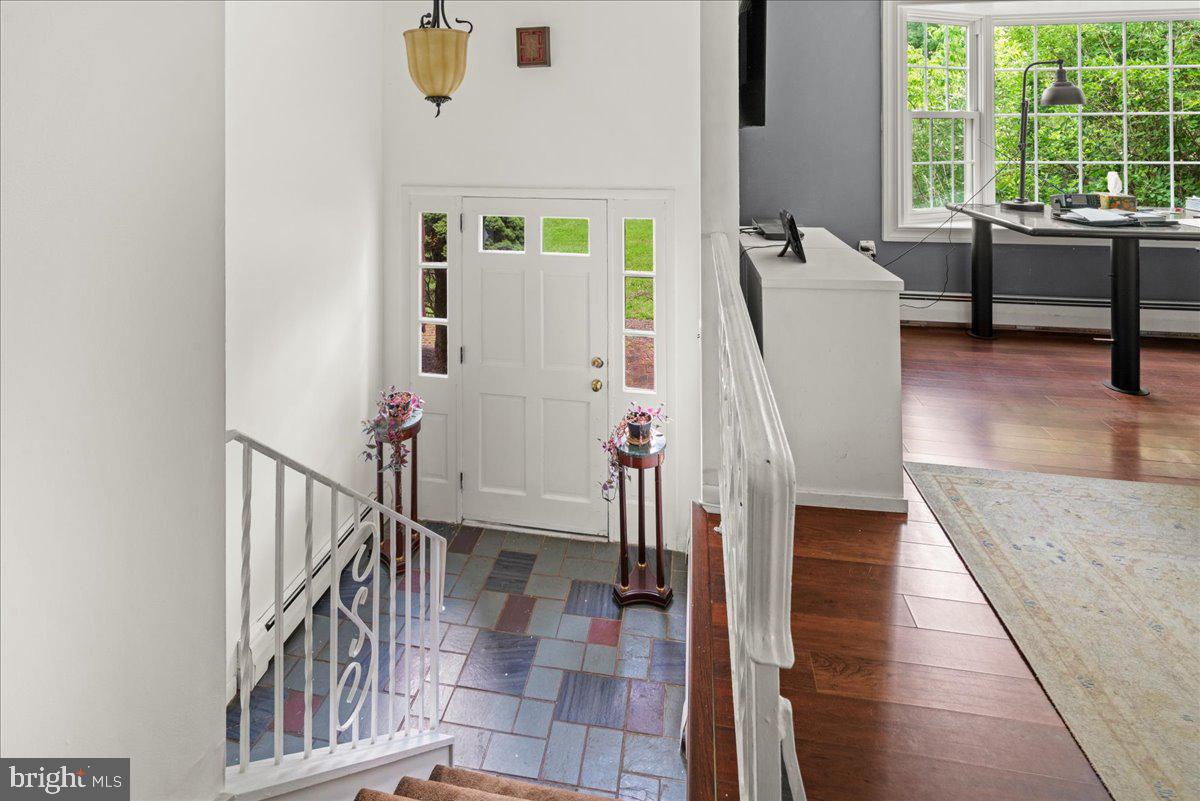 111 Howard Way Pennington, NJ 08534 - Photo 4 of 31 a view of a hallway with furniture and windows