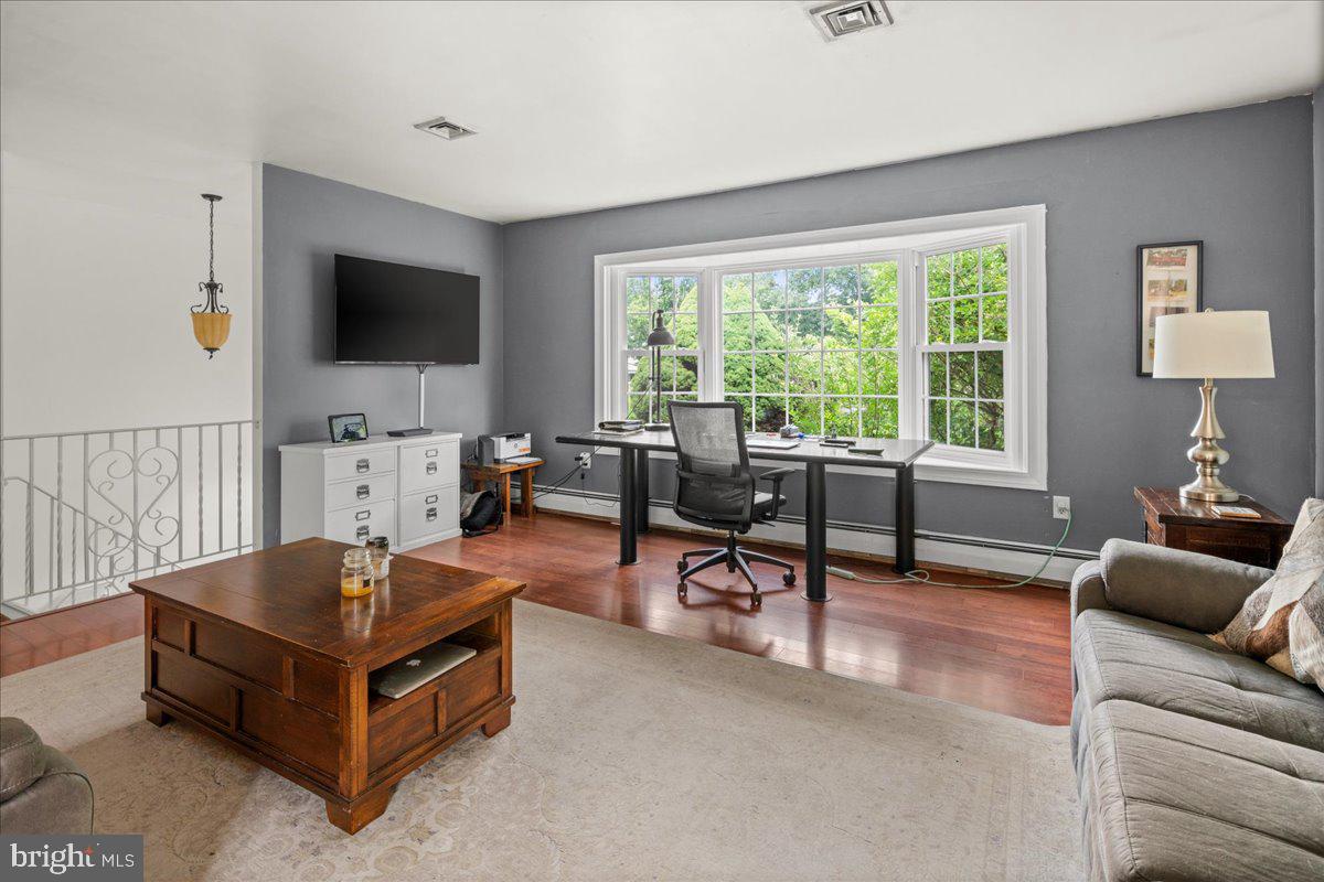 111 Howard Way Pennington, NJ 08534 - Photo 5 of 31 a living room with furniture and a flat screen tv