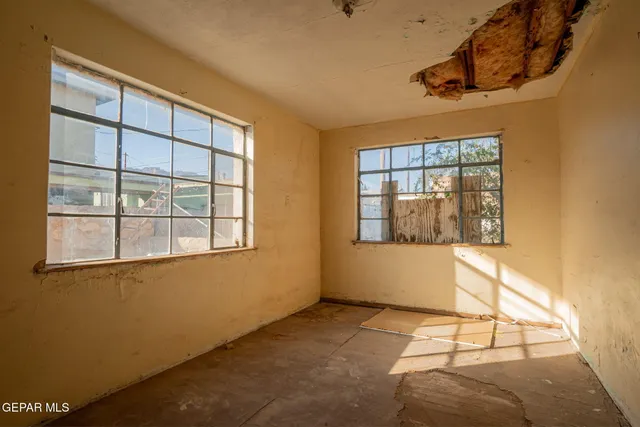 a view of an empty room with a window