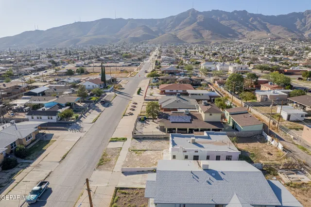 an aerial view of residential houses and city view