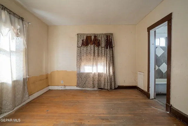 a view of an empty room and window
