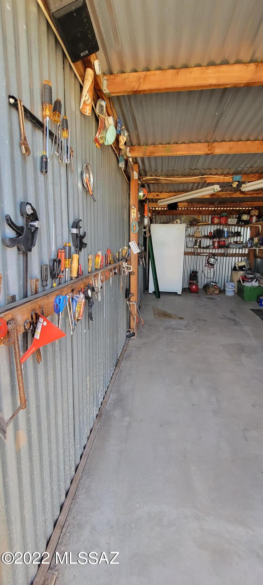3399 Red Stag Road Pearce, AZ 85625 - Photo 8 of 47 a view of a room with wooden walls