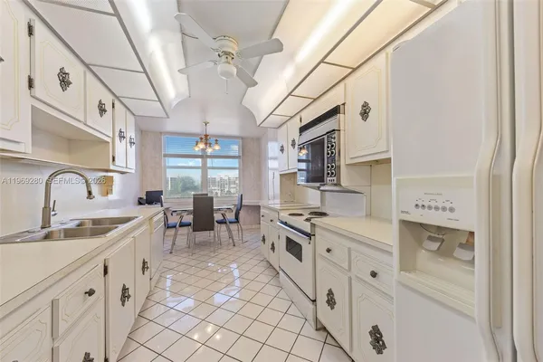 a kitchen with stainless steel appliances a sink and a stove
