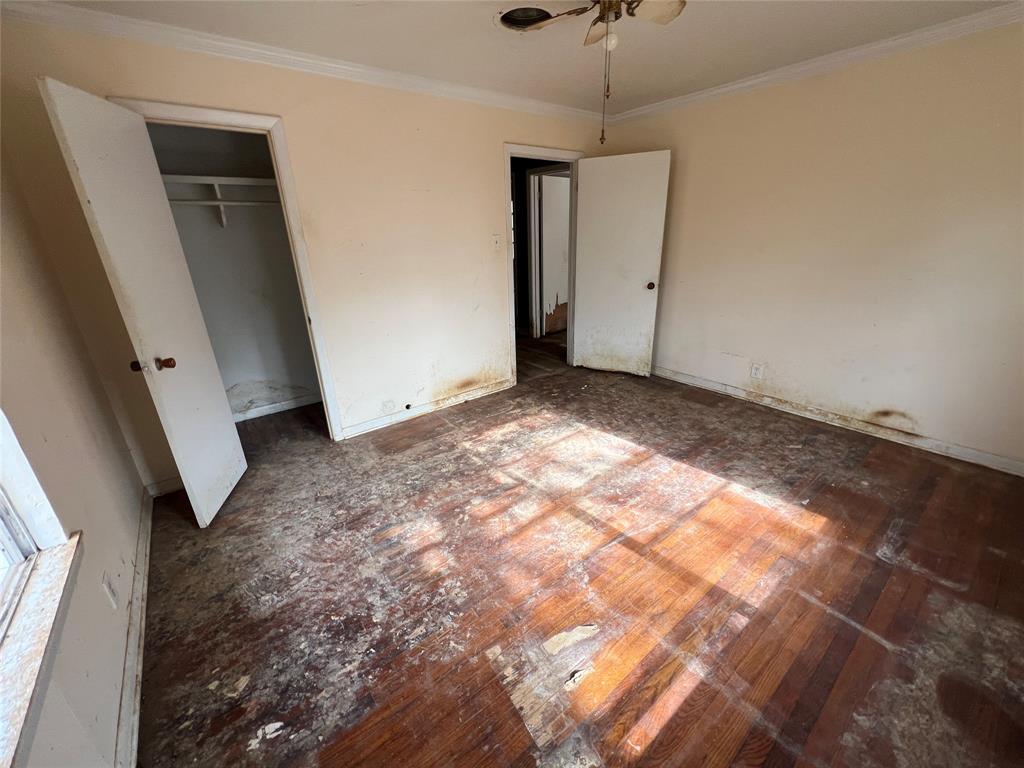 492 Richerson Road Denison, TX 75021 - Photo 11 of 29 a view of a big room with closet and windows