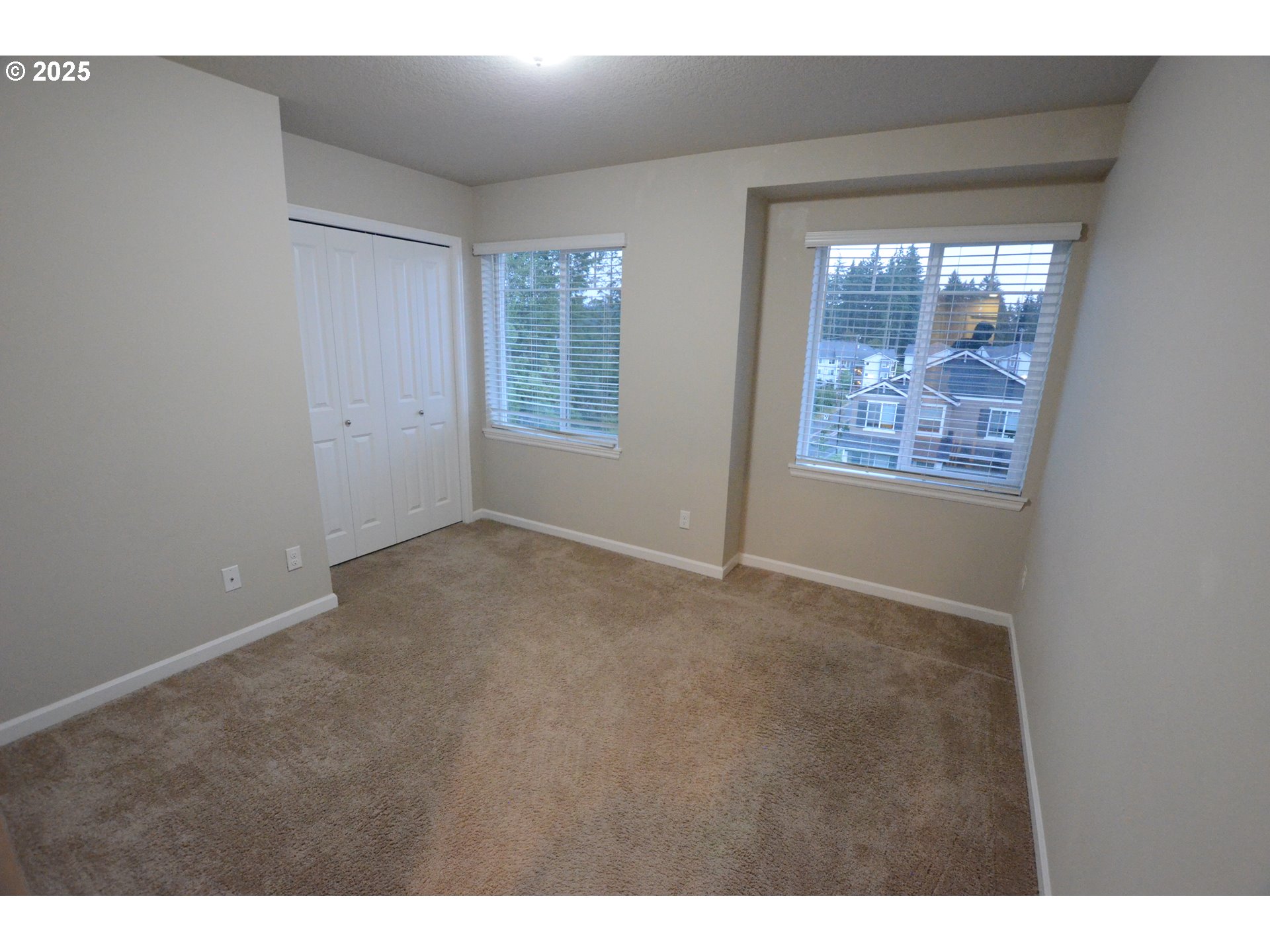 15557 Southwest Wren Lane Beaverton, OR 97007 - Photo 11 of 28 a view of an empty room with a window