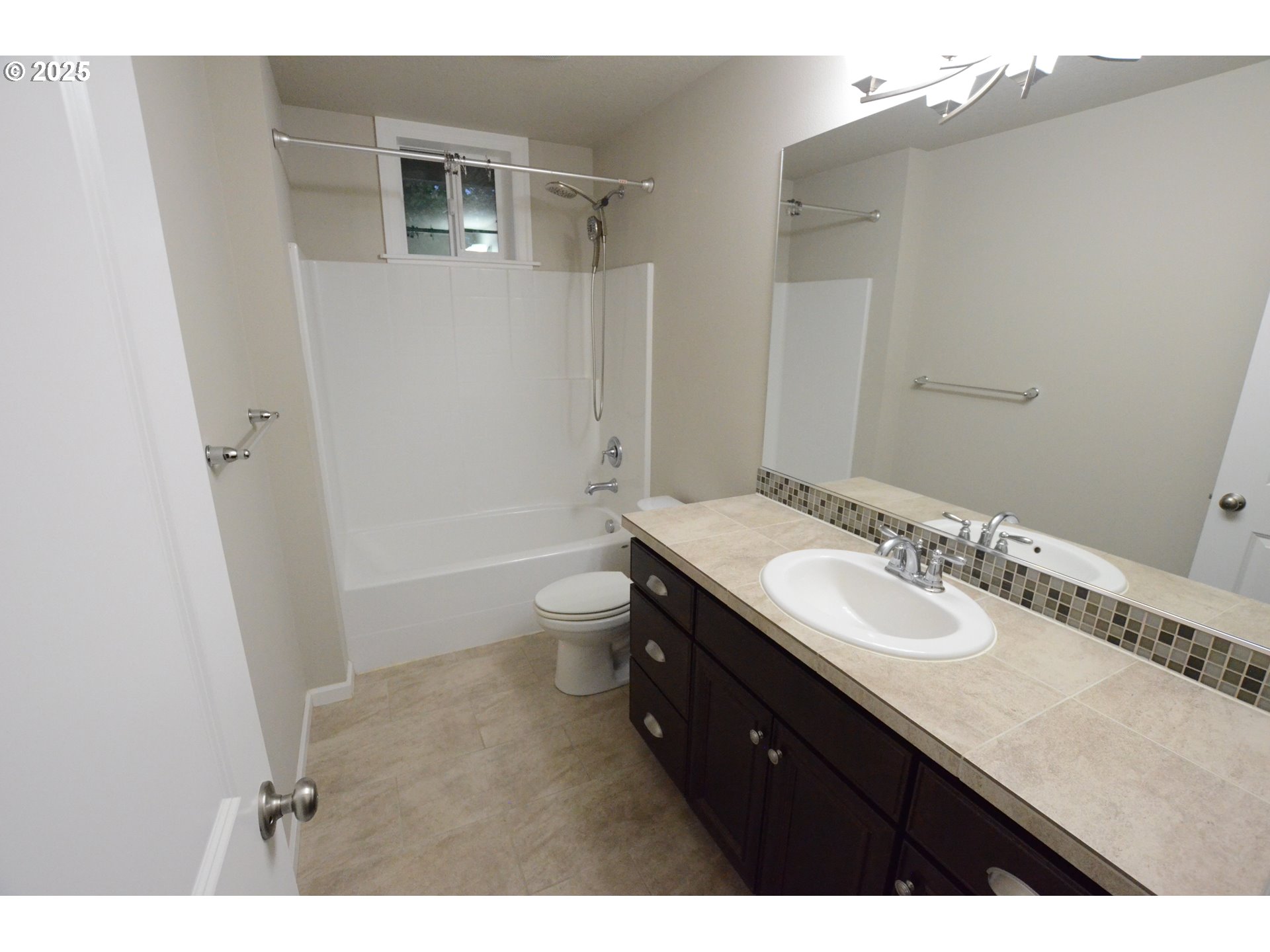 15557 Southwest Wren Lane Beaverton, OR 97007 - Photo 17 of 28 a bathroom with a sink a toilet and a mirror