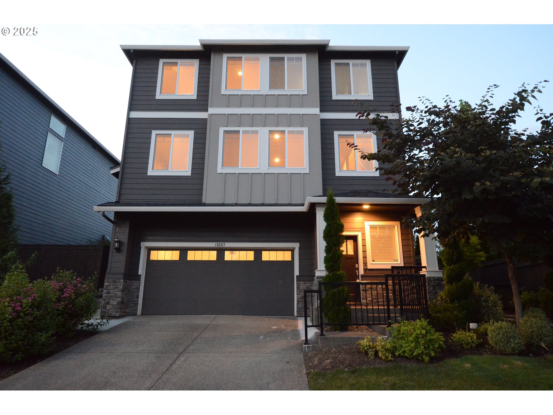 15557 Southwest Wren Lane Beaverton, OR 97007 - Photo 21 of 28 a front view of a house with a yard