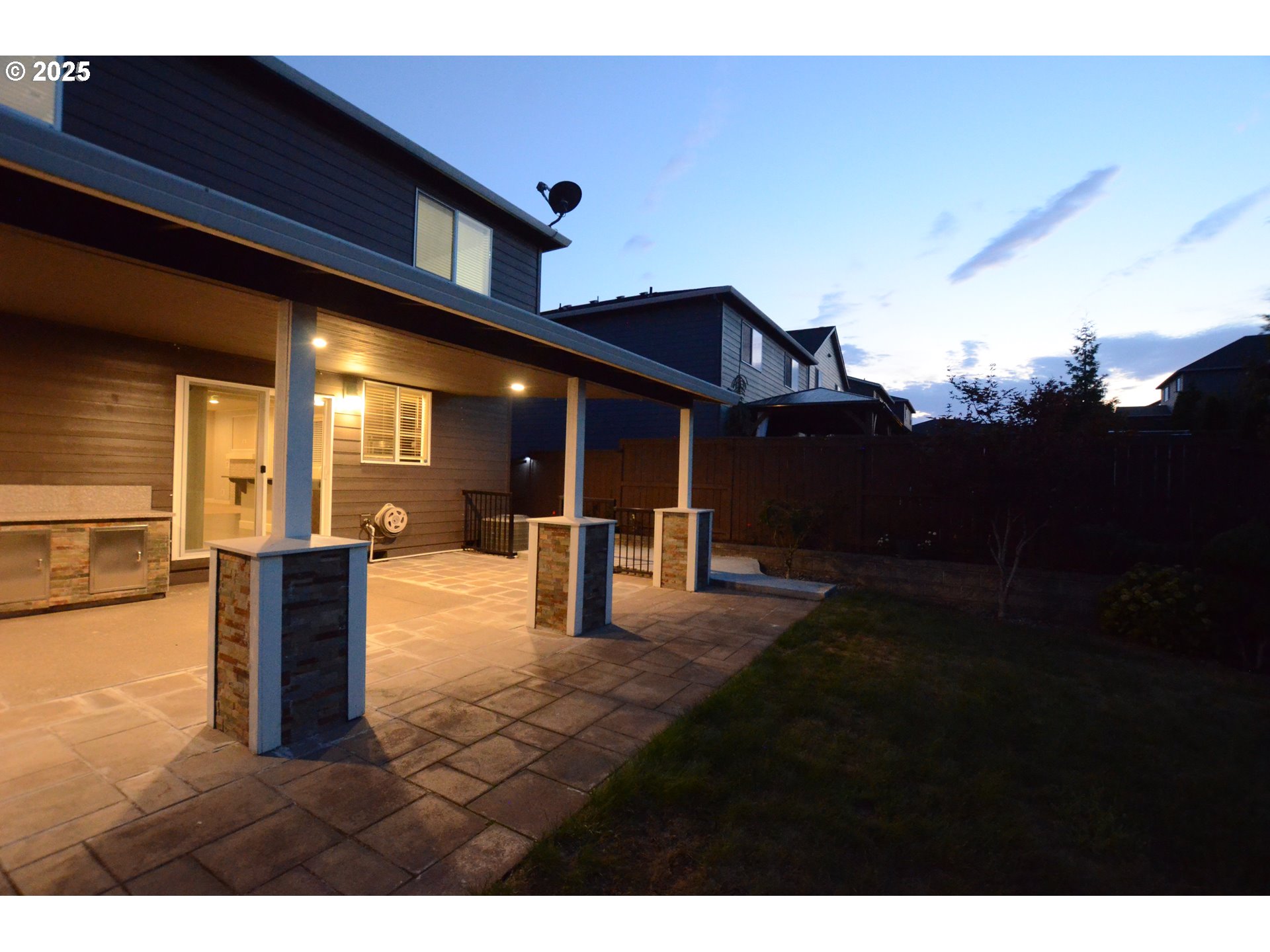 15557 Southwest Wren Lane Beaverton, OR 97007 - Photo 23 of 28 a view of a patio with couches and table and chairs with wooden floor
