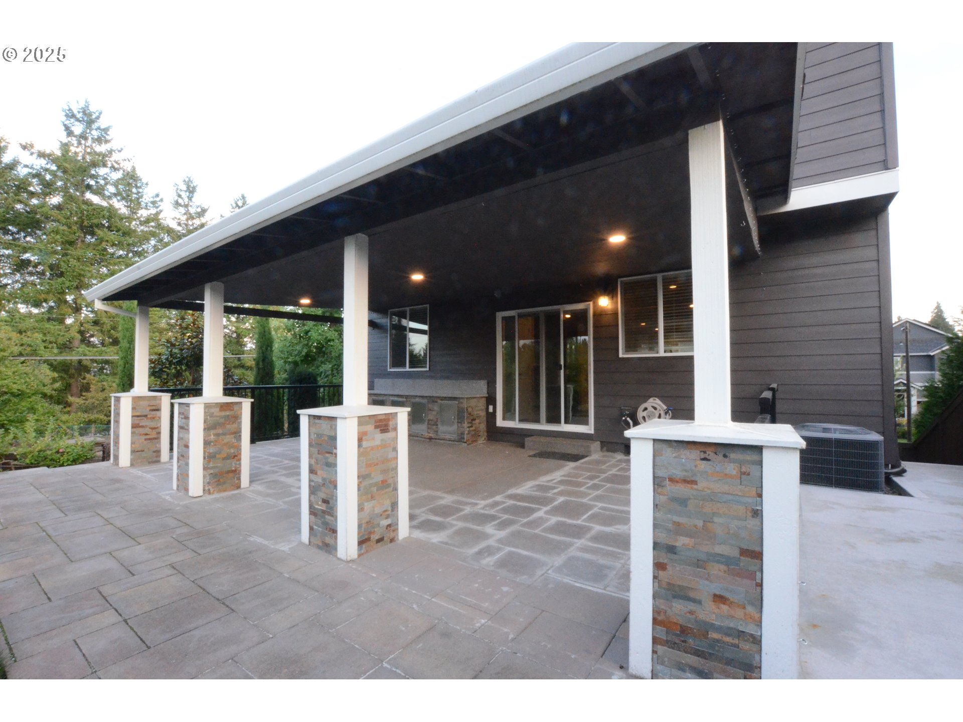 15557 Southwest Wren Lane Beaverton, OR 97007 - Photo 24 of 28 a view of a patio with table and chairs and potted plants