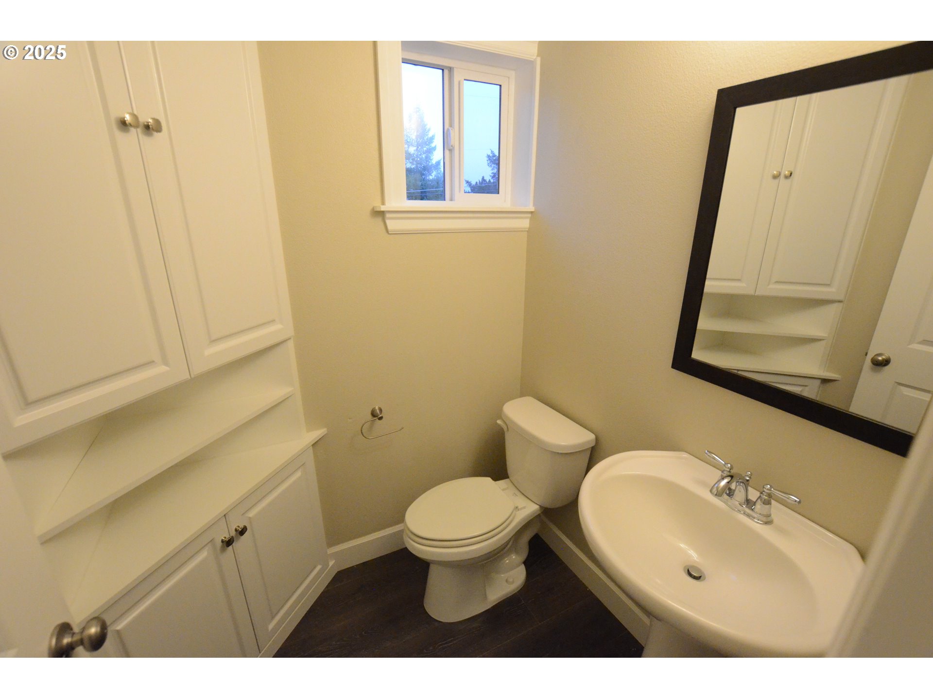 15557 Southwest Wren Lane Beaverton, OR 97007 - Photo 7 of 28 a bathroom with a sink a toilet and a mirror
