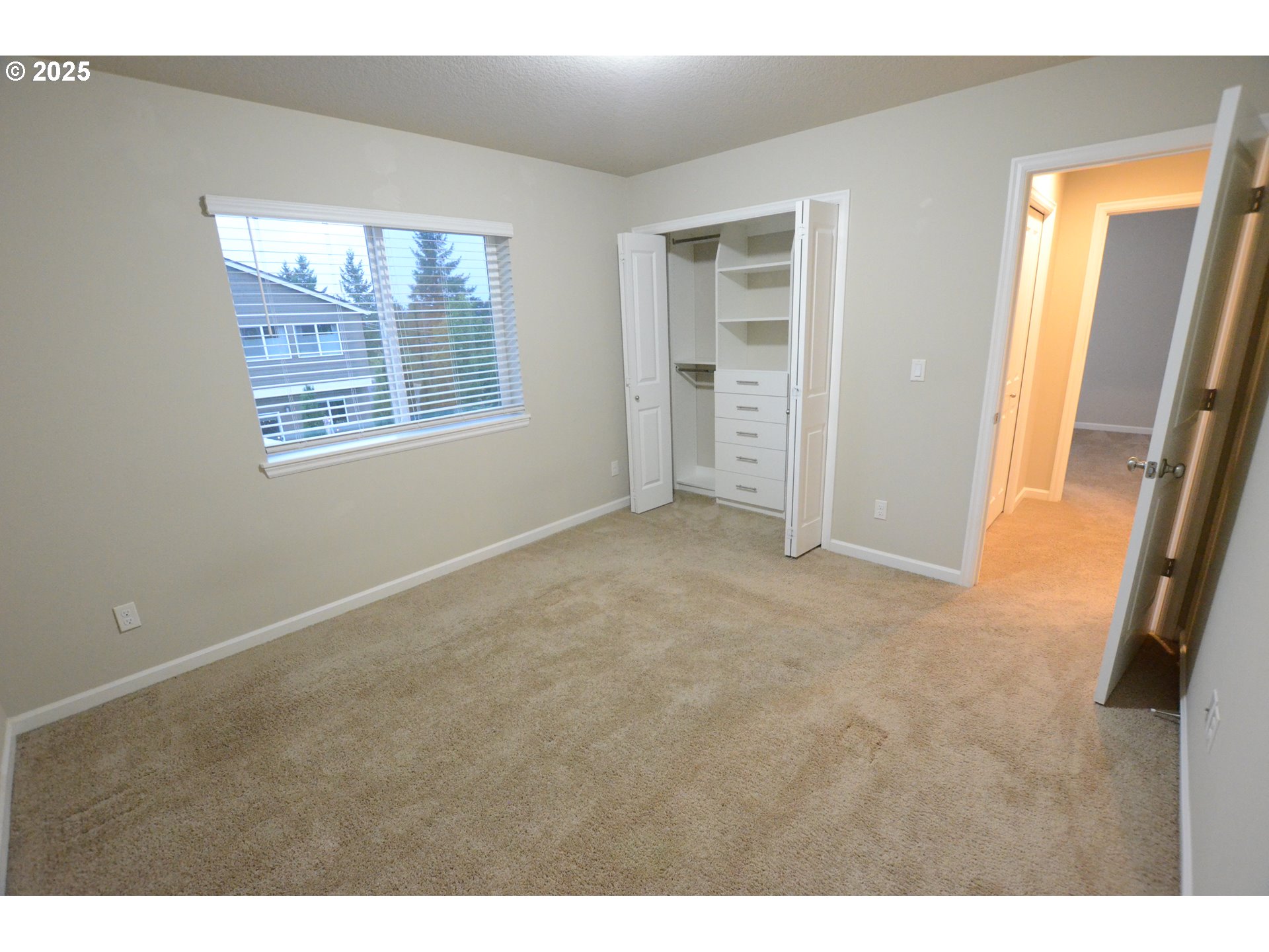 15557 Southwest Wren Lane Beaverton, OR 97007 - Photo 10 of 28 a view of an empty room with a window