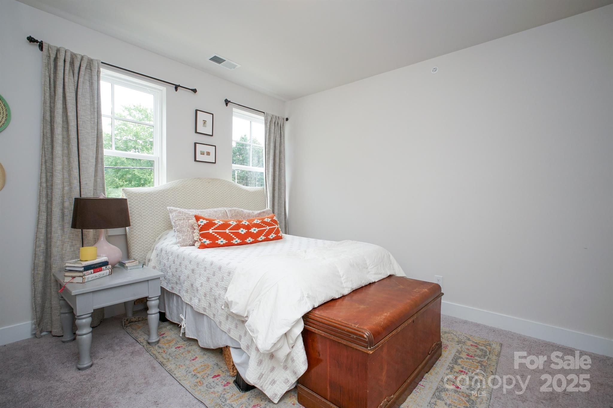 711 Beaty Street Davidson, NC 28036 - Photo 16 of 22 a bedroom with a bed and a couch