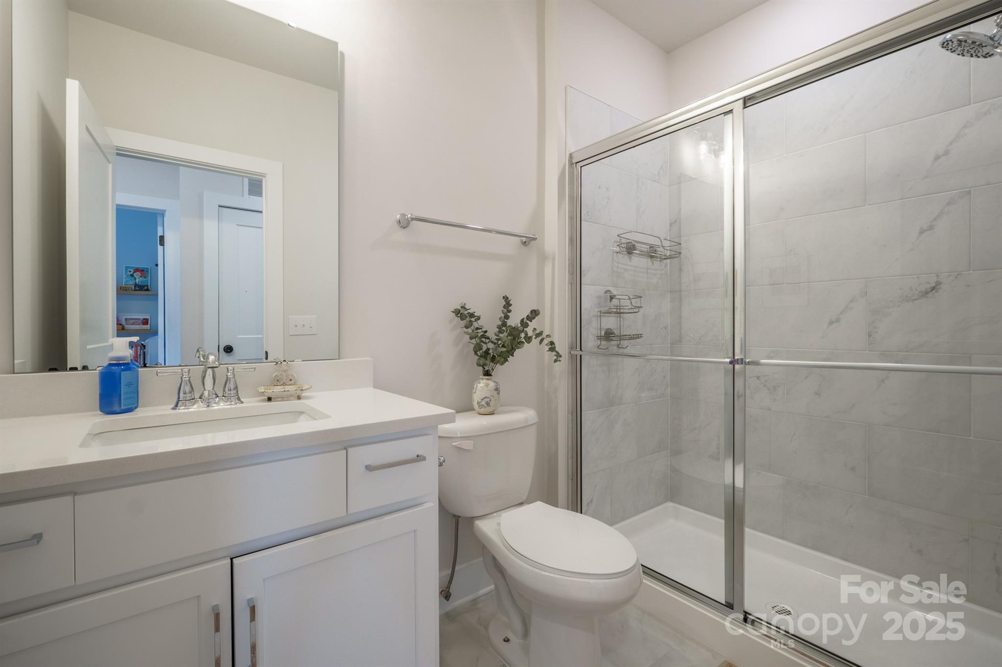 711 Beaty Street Davidson, NC 28036 - Photo 18 of 22 a bathroom with a sink toilet and shower