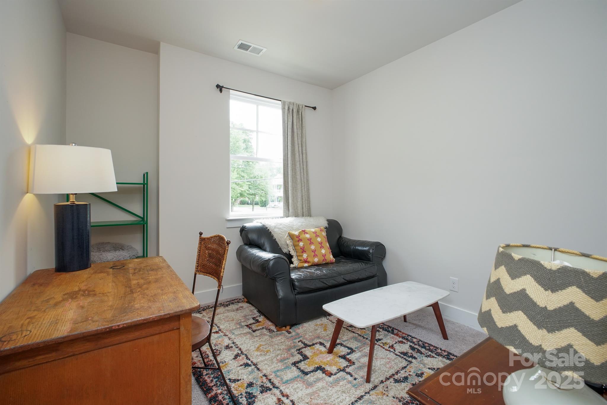 711 Beaty Street Davidson, NC 28036 - Photo 19 of 22 a living room with furniture and a window