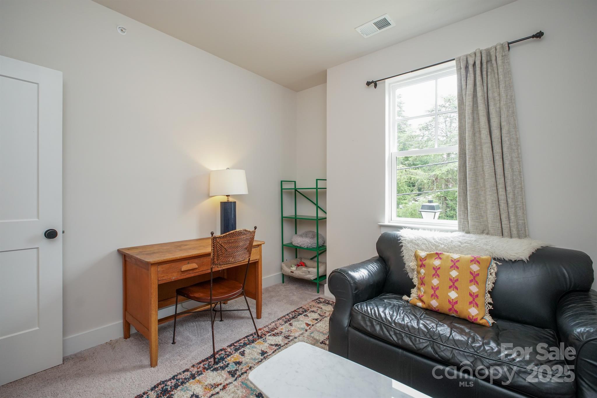 711 Beaty Street Davidson, NC 28036 - Photo 20 of 22 a living room with furniture and a window