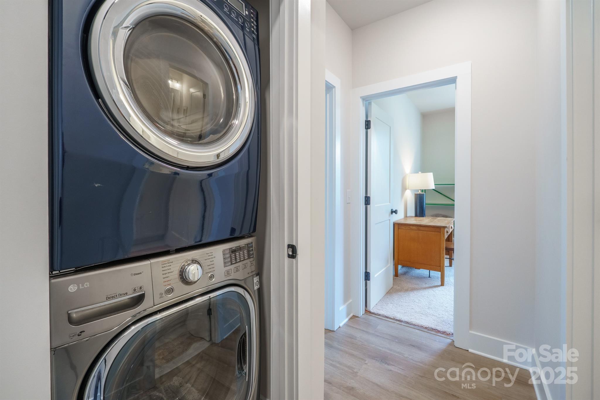 711 Beaty Street Davidson, NC 28036 - Photo 22 of 22 a view of a hallway with washer and dryer