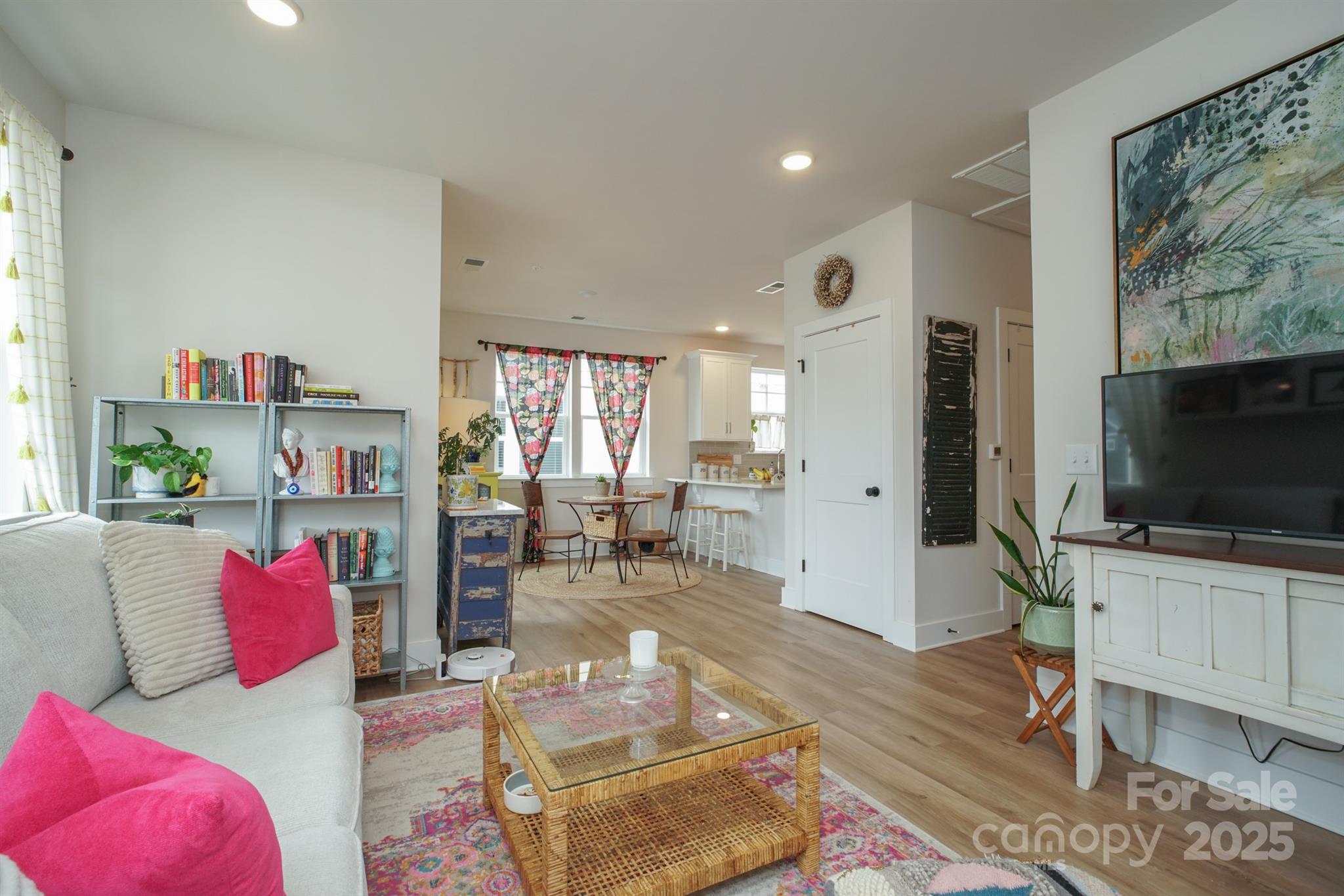 711 Beaty Street Davidson, NC 28036 - Photo 4 of 22 a living room with furniture and a flat screen tv
