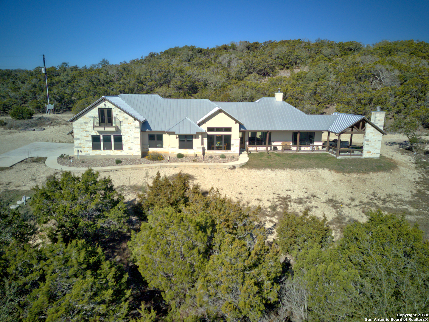 1310 Mystic Breeze Spring Branch, TX 78070 - Photo 1 of 1 a view of a big house with a big yard and large tree