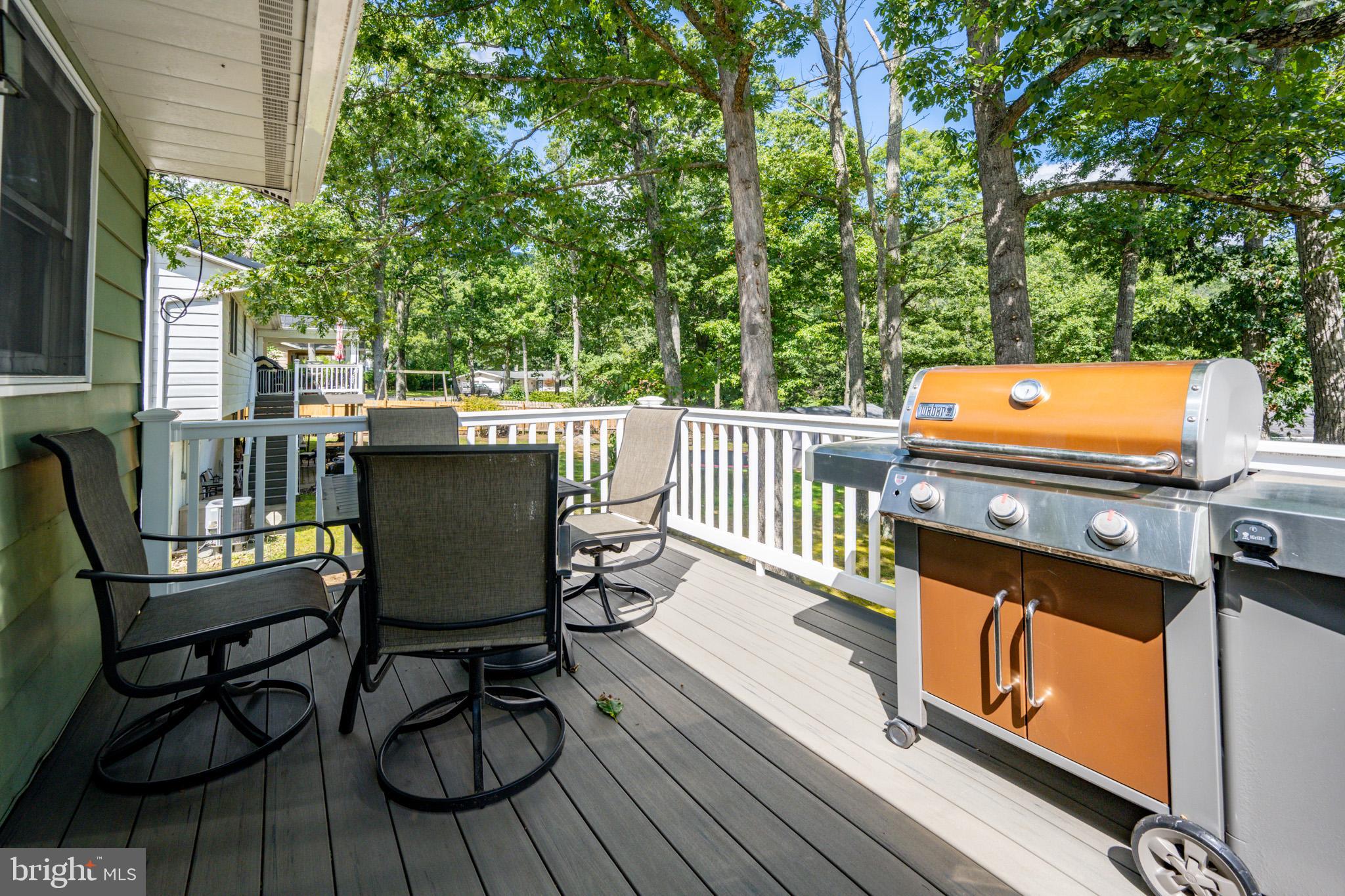 15105 Laurel Ridge Road Southwest Cumberland, MD 21502 - Photo 21 of 54 a view of a chairs and table on the deck