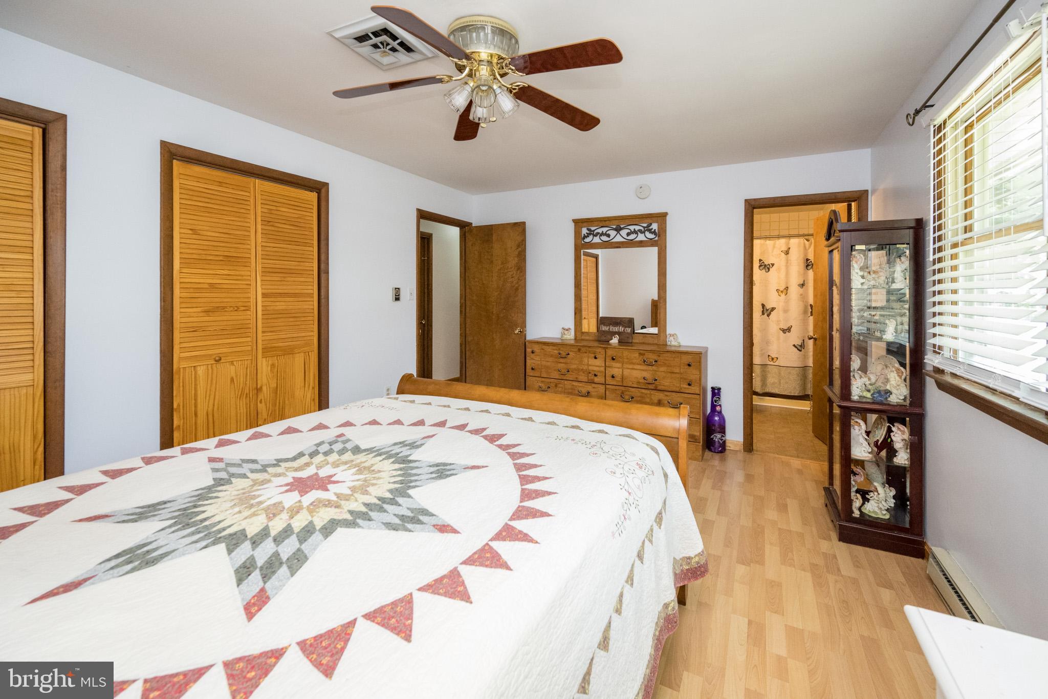 15105 Laurel Ridge Road Southwest Cumberland, MD 21502 - Photo 26 of 54 a spacious bedroom with a large bed and a large window