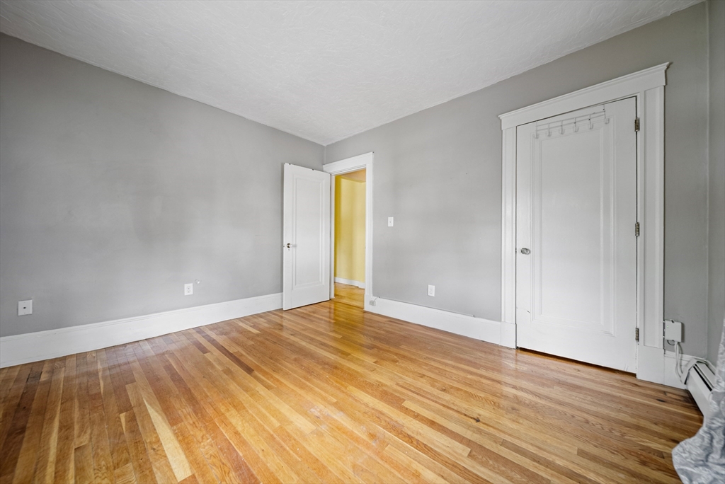 52 High Street, Unit 5 Methuen, MA 01844 - Photo 19 of 32 a view of an empty room and wooden floor