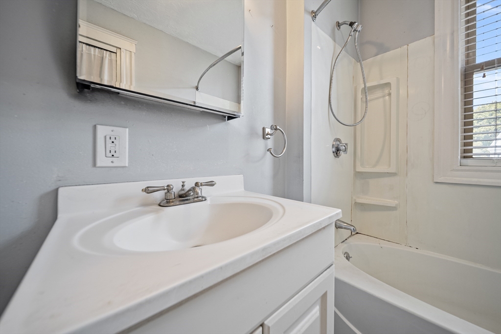 52 High Street, Unit 5 Methuen, MA 01844 - Photo 23 of 32 a bathroom with a sink and a bathtub
