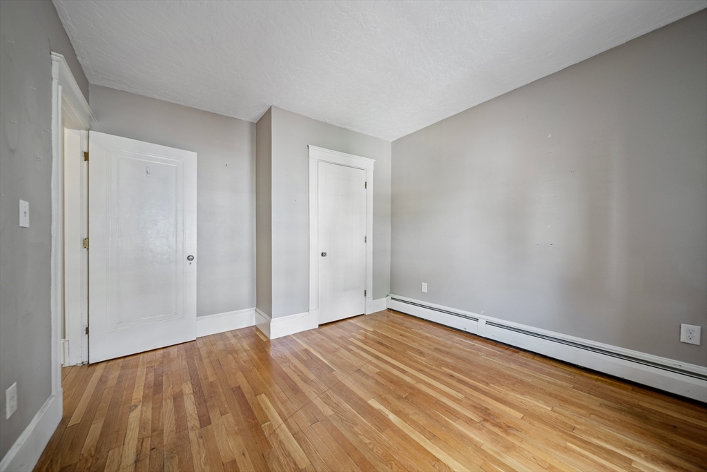 52 High Street, Unit 5 Methuen, MA 01844 - Photo 25 of 32 a view of an empty room with wooden floor