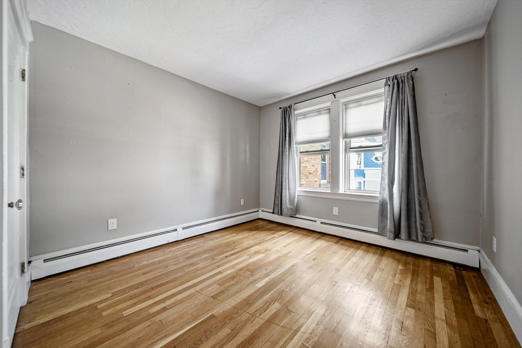52 High Street, Unit 5 Methuen, MA 01844 - Photo 28 of 32 wooden floor in an empty room with a window