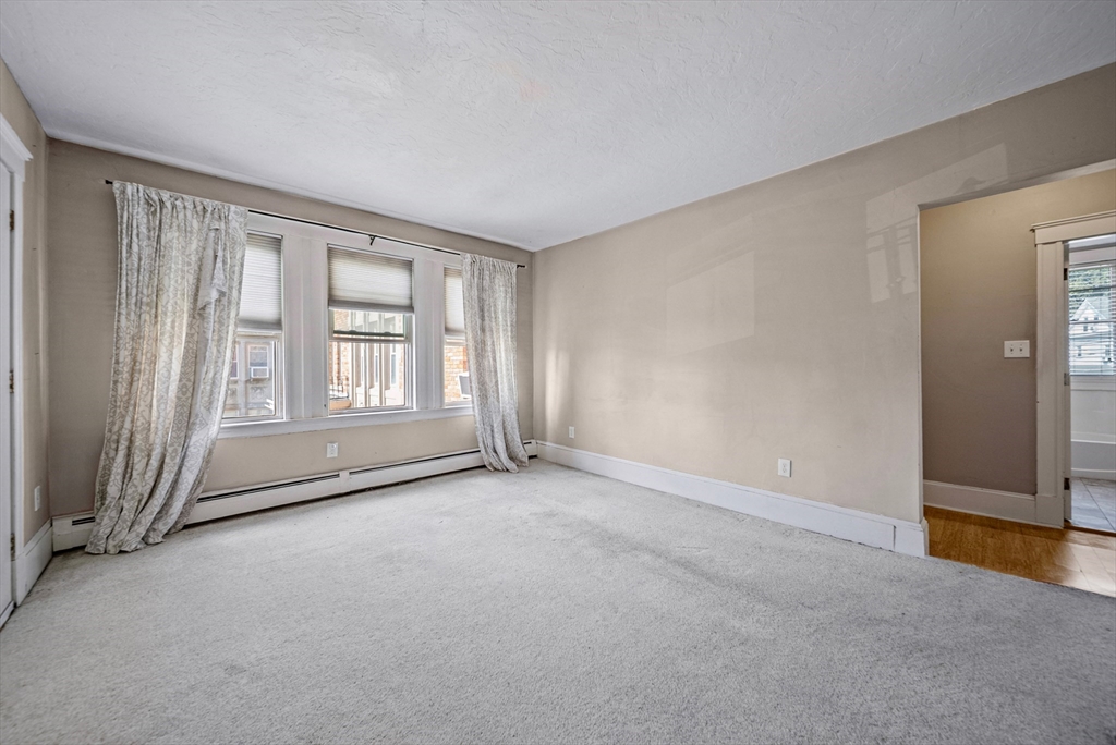 52 High Street, Unit 5 Methuen, MA 01844 - Photo 32 of 32 an empty room with windows