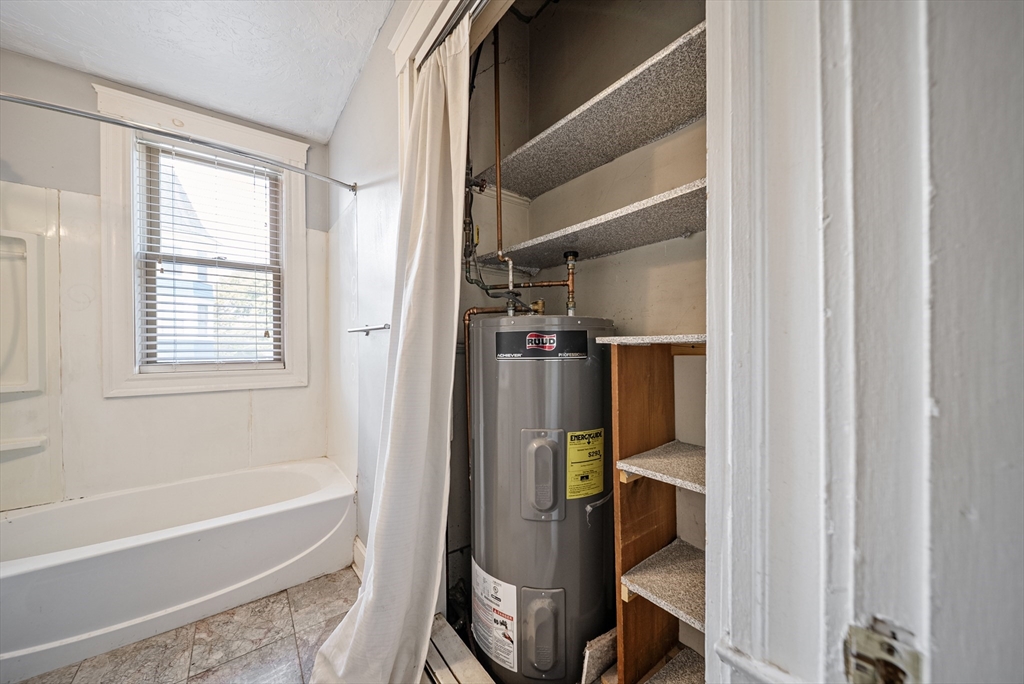52 High Street, Unit 5 Methuen, MA 01844 - Photo 8 of 32 a bathroom with a bathtub and a shower