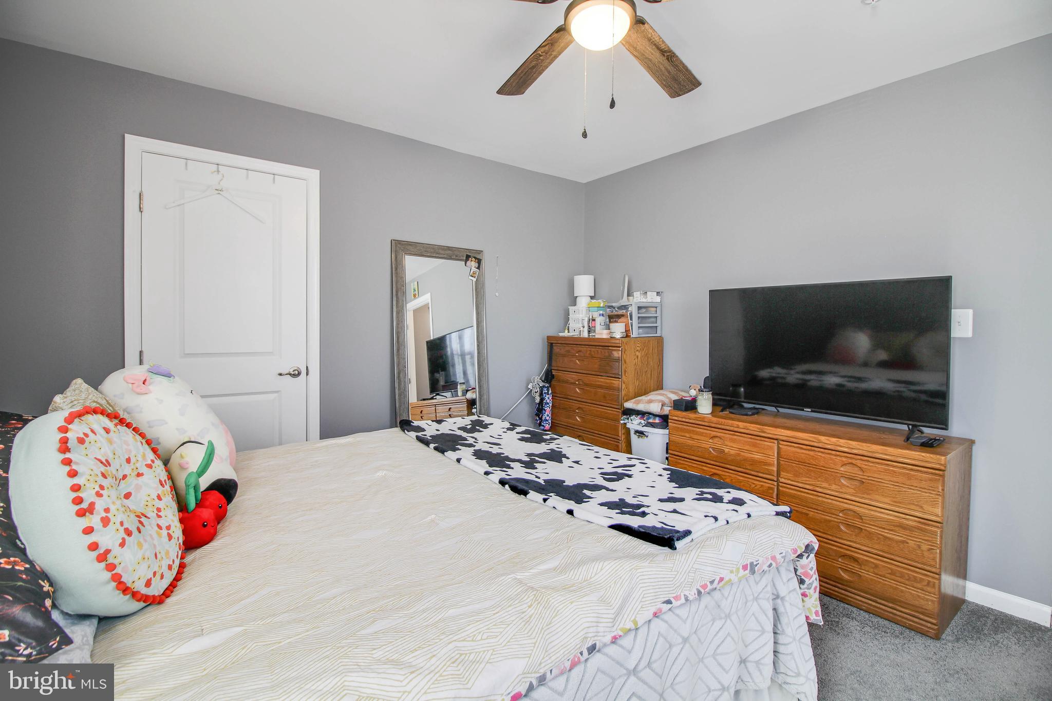 1634 Cape May Road Essex, MD 21221 - Photo 11 of 27 a bedroom with a bed and flat screen tv