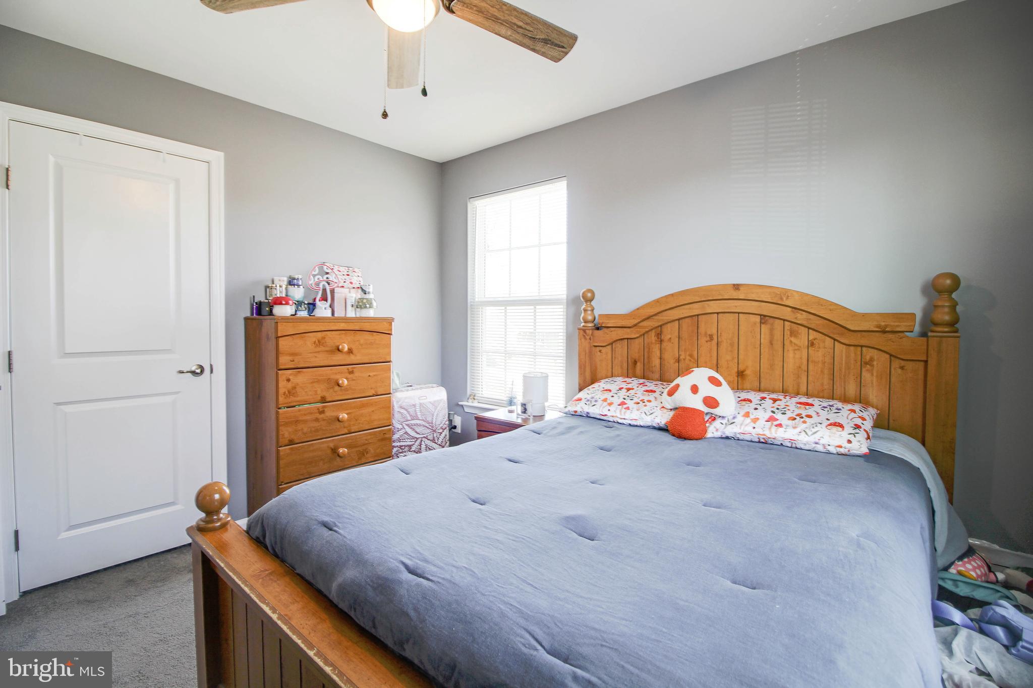 1634 Cape May Road Essex, MD 21221 - Photo 13 of 27 a bedroom with a bed and a chandelier