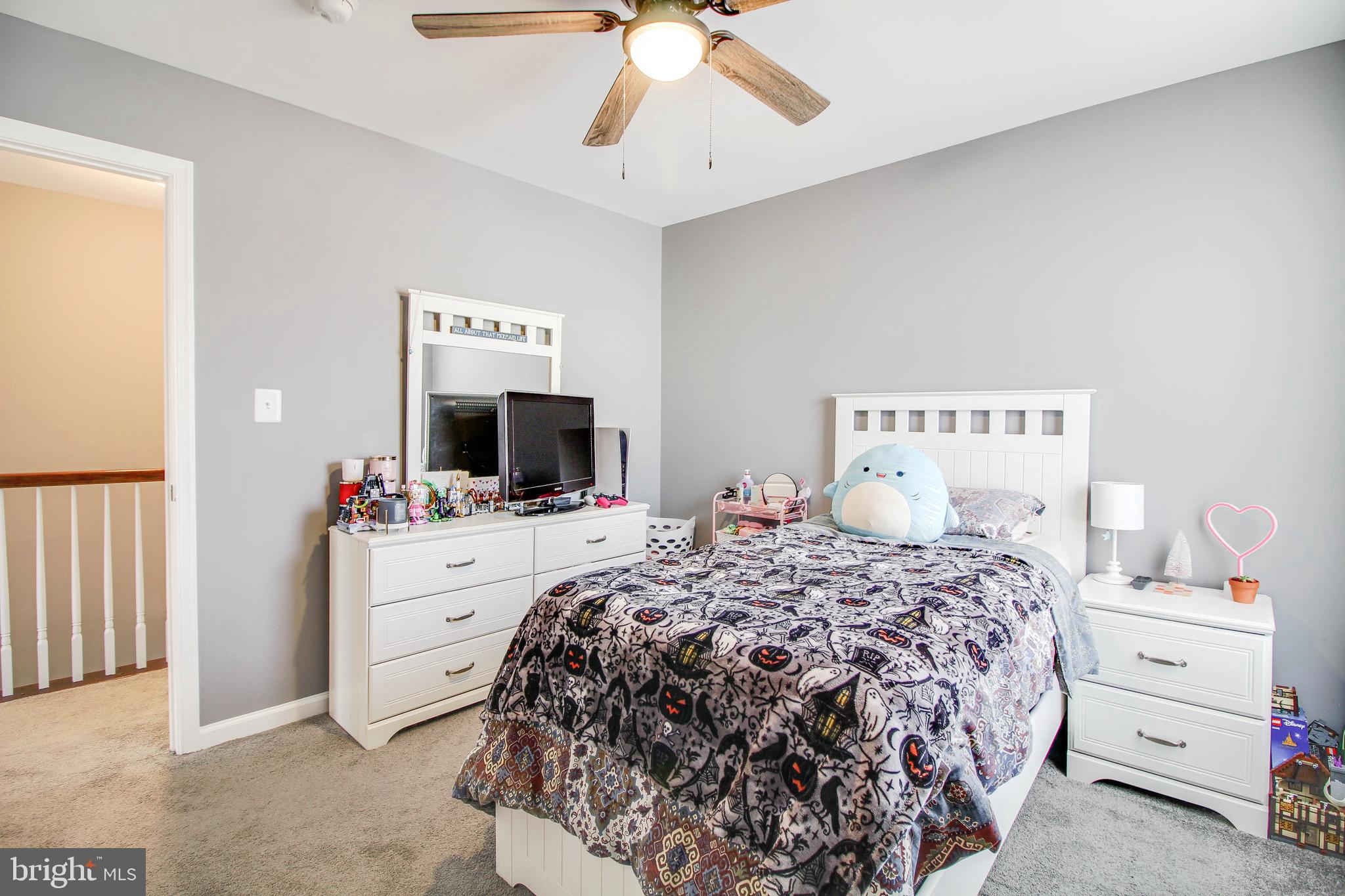 1634 Cape May Road Essex, MD 21221 - Photo 15 of 27 a bedroom with a bed and a flat screen tv