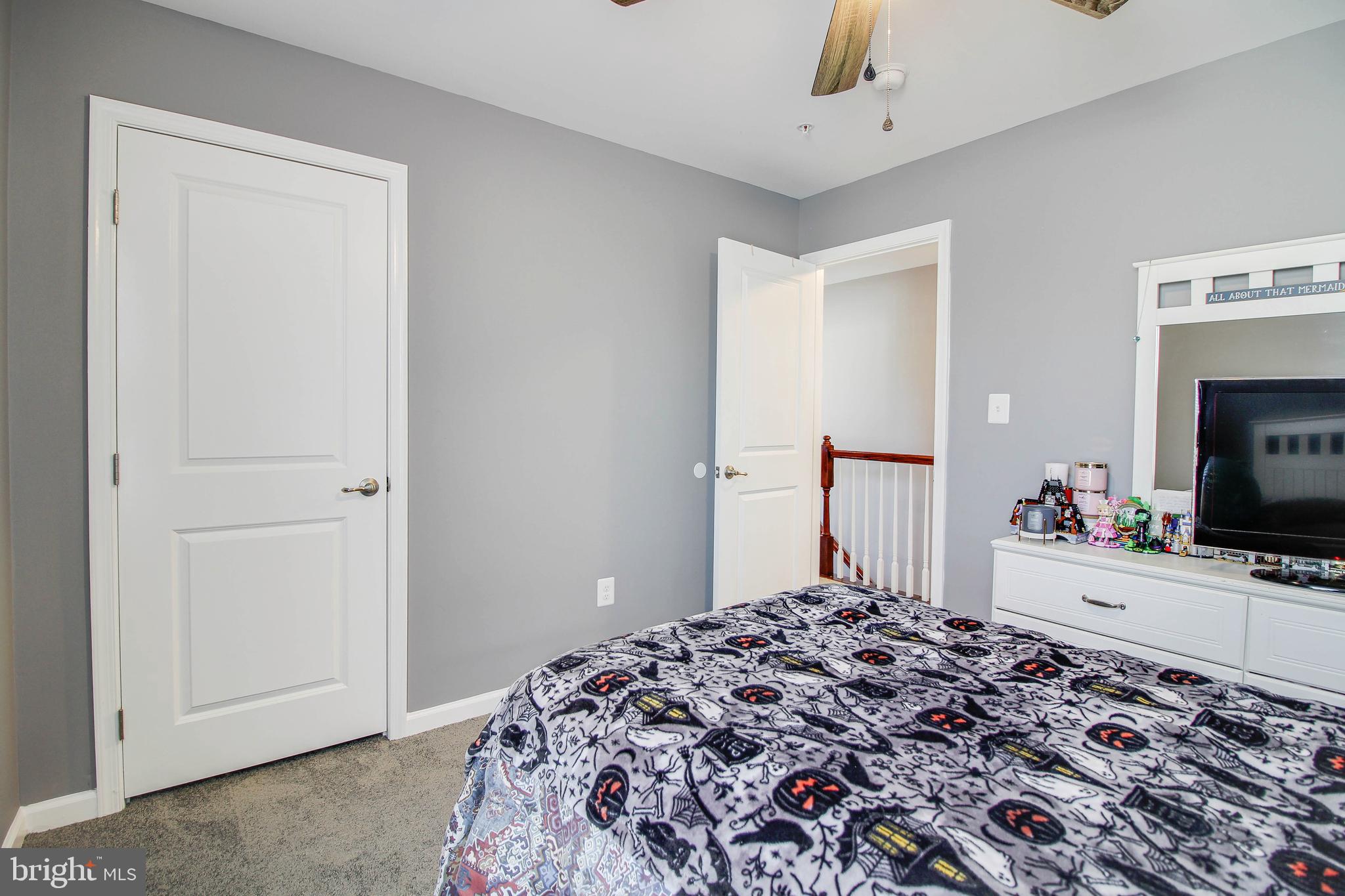 1634 Cape May Road Essex, MD 21221 - Photo 16 of 27 a bedroom with a bed and a flat screen tv