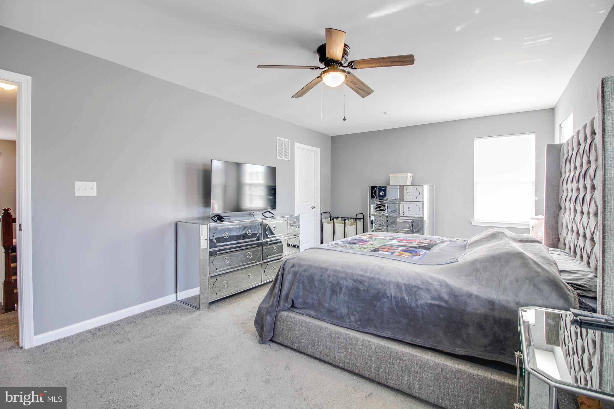 1634 Cape May Road Essex, MD 21221 - Photo 19 of 27 a bedroom with a bed and a chandelier