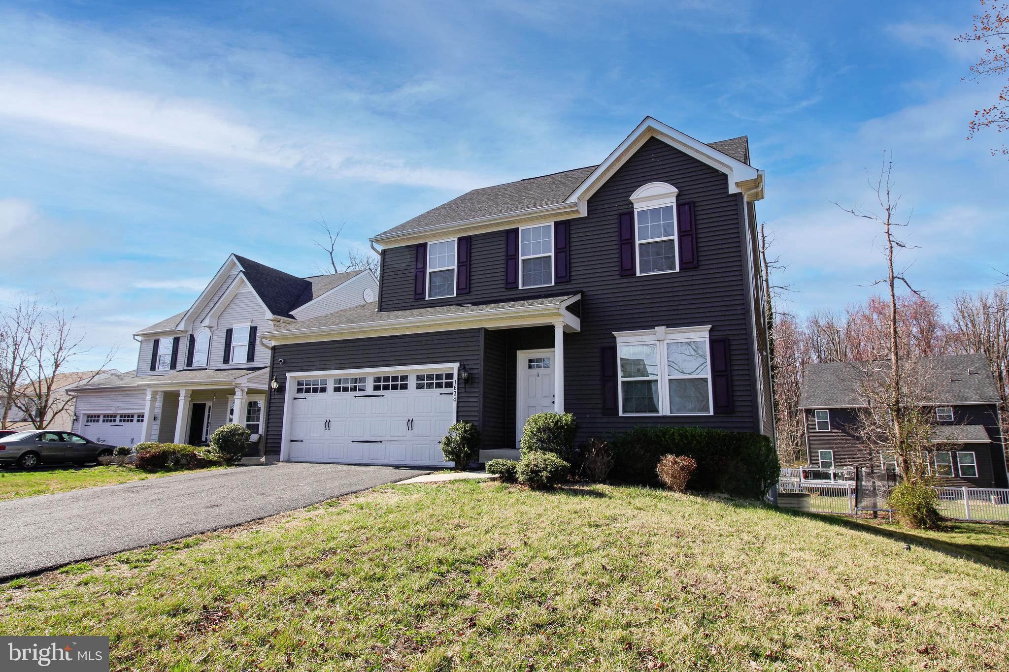 1634 Cape May Road Essex, MD 21221 - Photo 25 of 27 a front view of a house with a yard