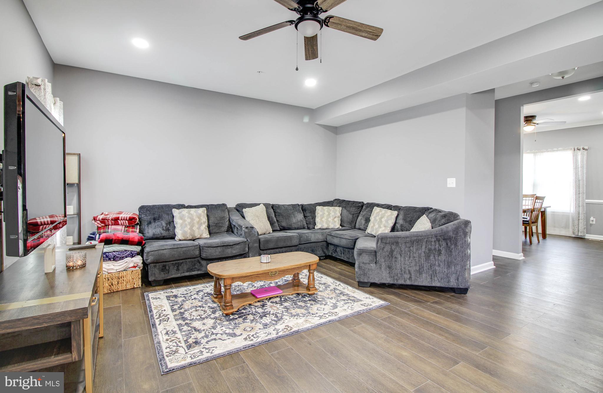 1634 Cape May Road Essex, MD 21221 - Photo 5 of 27 a living room with furniture and a flat screen tv