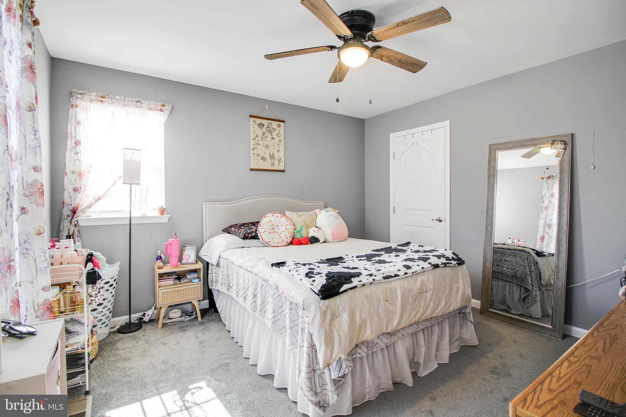 1634 Cape May Road Essex, MD 21221 - Photo 8 of 27 a bedroom with bed and a chandelier