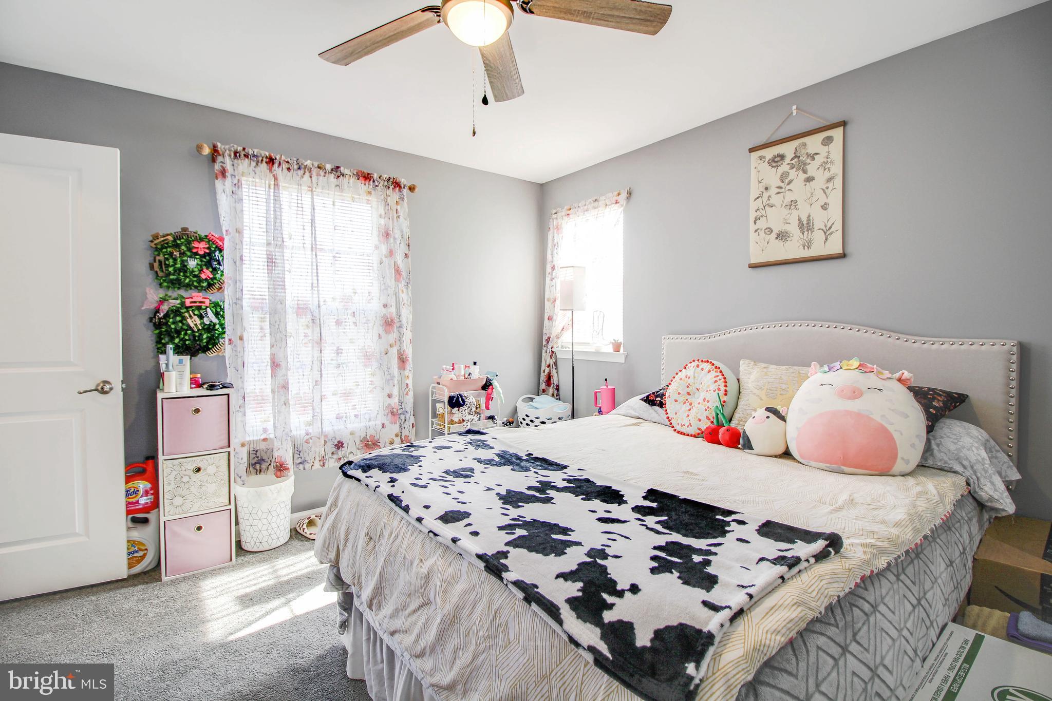 1634 Cape May Road Essex, MD 21221 - Photo 10 of 27 a bedroom with a bed and a window