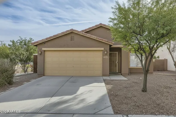 a front view of a house with a garage