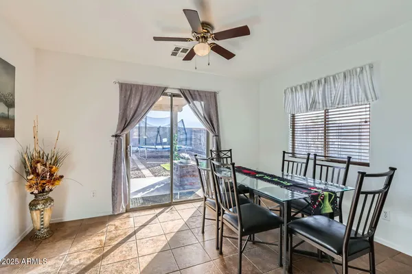 a large kitchen with stainless steel appliances granite countertop a refrigerator and a sink