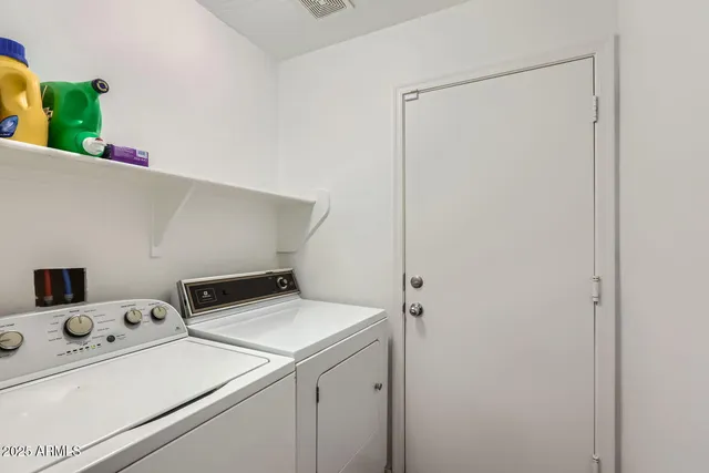 a view of a chairs and table in the patio