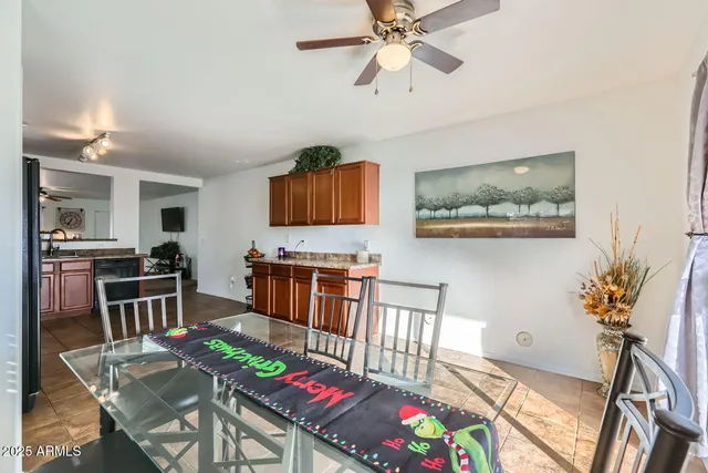 a large kitchen with stainless steel appliances granite countertop a refrigerator and a sink