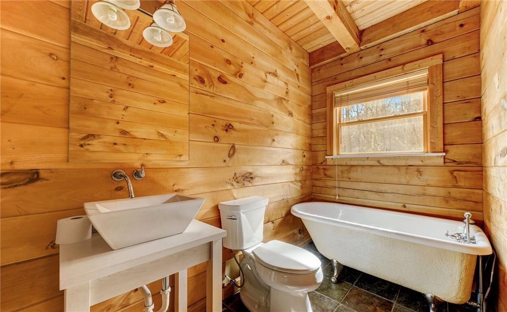 245 Silver Rock Road Adrian, PA 16210 - Photo 21 of 50 a bathroom with a sink toilet and shower