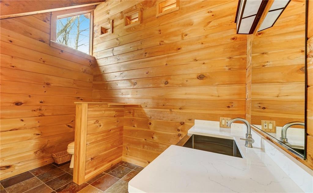 245 Silver Rock Road Adrian, PA 16210 - Photo 29 of 50 a bathroom with a sink and a shower